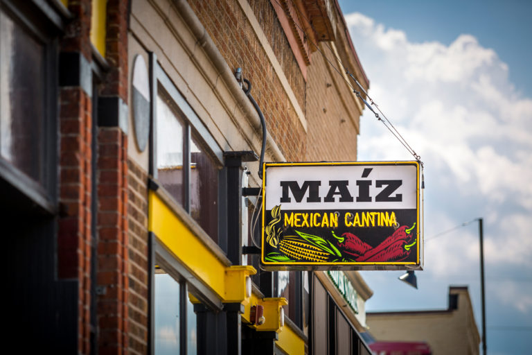 Street view of Maiz Mexican Cantina restaurant sign.